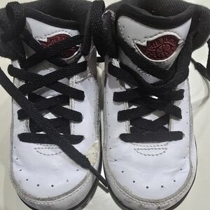 Kids Jordan Black and White Sneakers